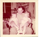 Clayton Dupree holding Diane Deloache and Emilane Joyner
